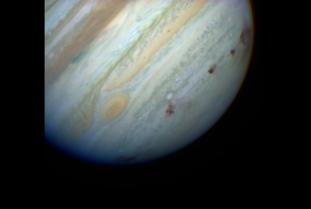 Jupiter showing debries of impact in its upper atmosphere from comet Shoemaker-Levy 9 (SL9) on 18-07-1994 - HST_hs-1995-49-d-full_tif_990w