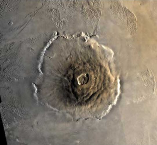 Mars - Olympus Mons shield volcano 24km(16mi)(78,000ft) above the Tharsis Plateau, caldera 80km(50mi)Dia, base 624km(374mi)Dia, rimmed by a cliff 6km (20,000ft)h