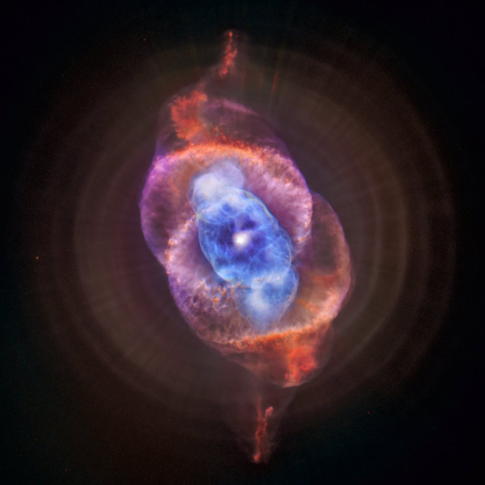 NGC6543 Cat's Eye (planertry) Nebula in Draco_11_composite of Chandra X-ray (blu) and HST (red & pur) NGC 6543 end Sol sized star - Cat's Eye Nebula_990w