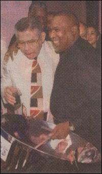 Smiling alongside each other;  Elliot Mannette (left) and Boogsie.